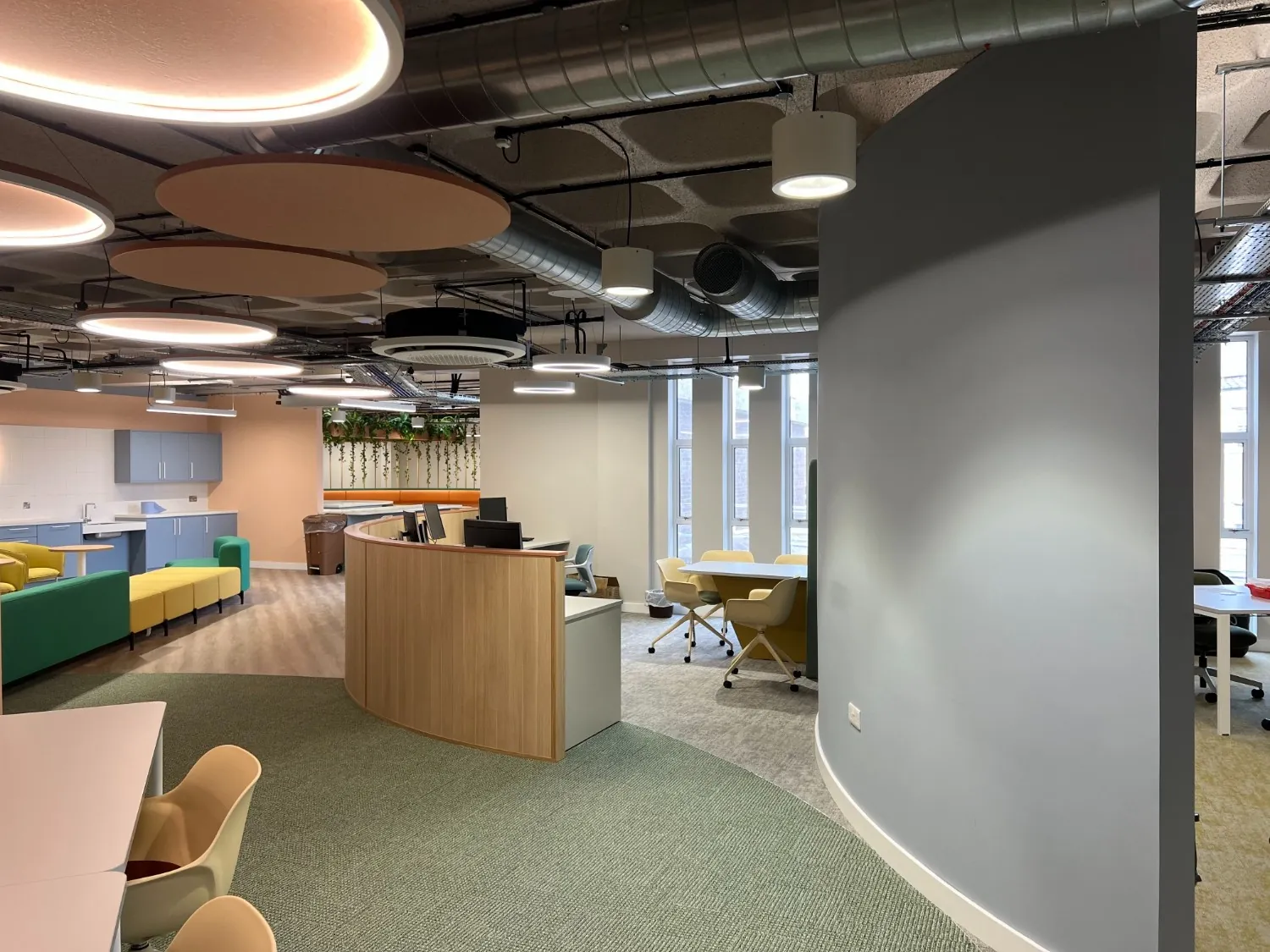 Office refurbishment in Poole with a curved drylined wall and suspended ceiling rafts